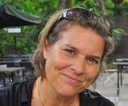 Headshot of Michelle Elvy wearing sunglasses