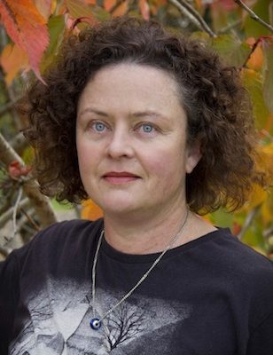 Headshot of Tina Shaw with autumnal background