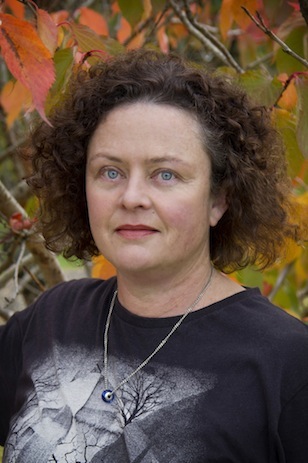Headshot of Tina Shaw with autumnal background