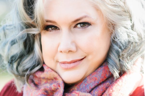 Close up of Paula Morris. She is wearing a scarf around her neck. Photo credit: Colleen Maria Lenihan.