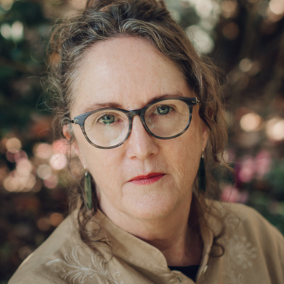 Headshot of Lynn Davidson with autumnal background
