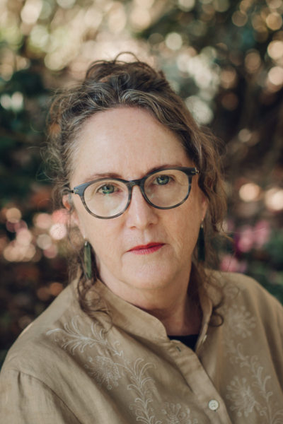 Headshot of Lynn Davidson with autumnal background
